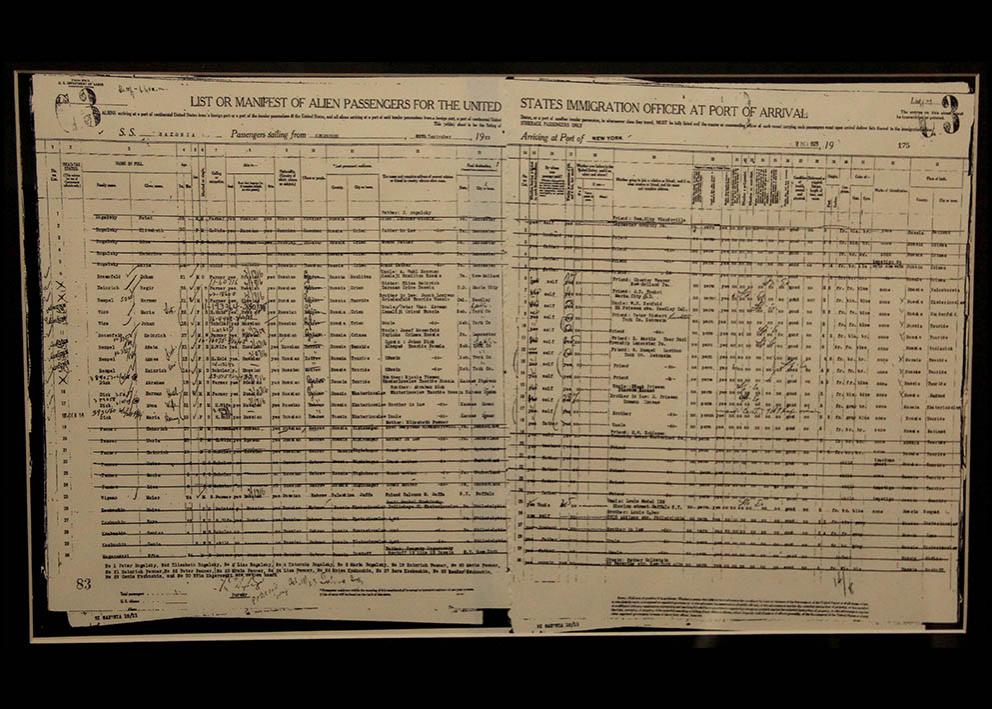 worn paper featuring handwritten text and the title list or manifest of alien passengers for the united states immigration officer at port of arrival